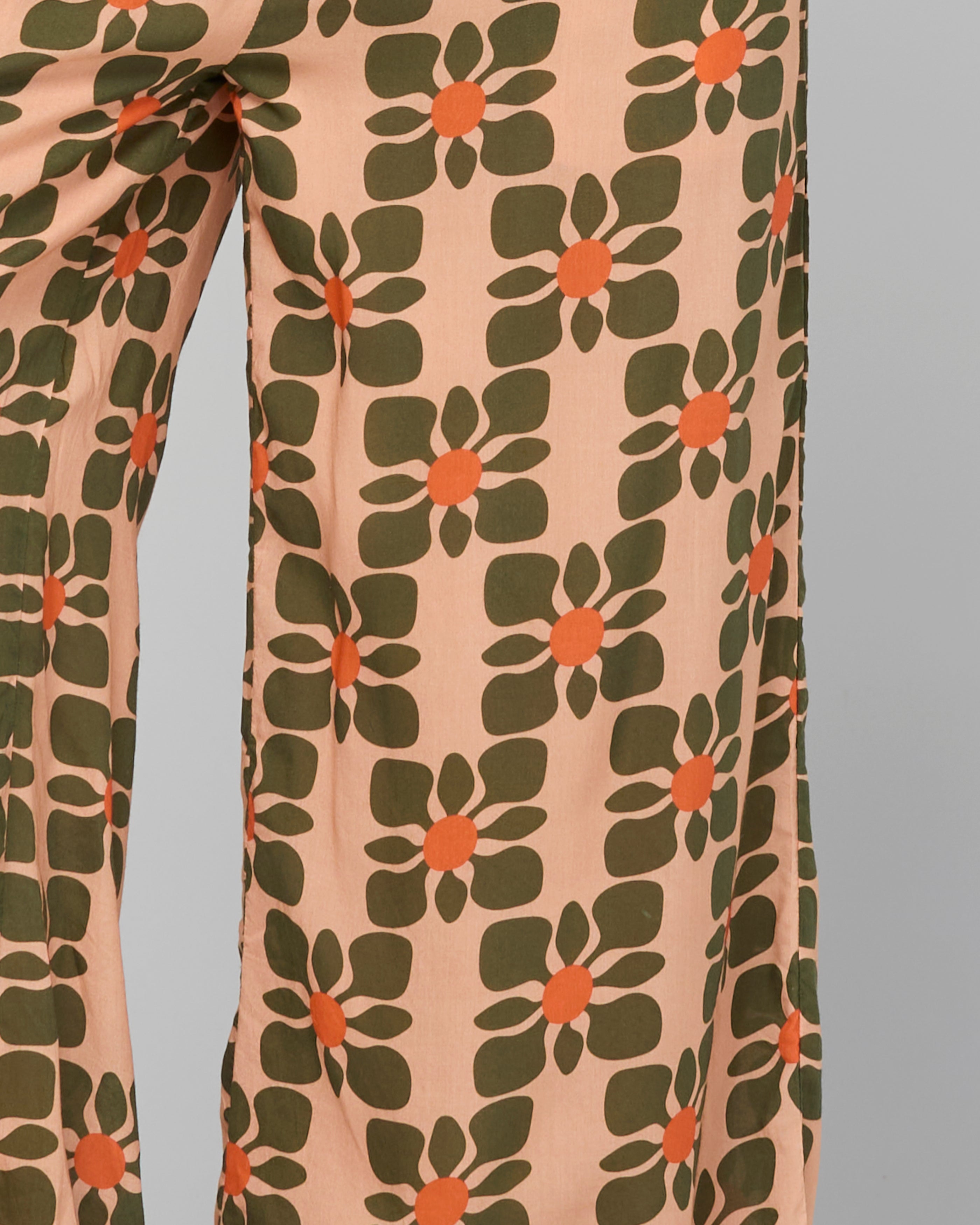 Floral patterned pants on a plain background