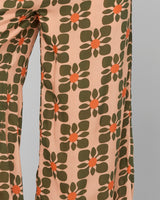 Floral patterned pants on a plain background